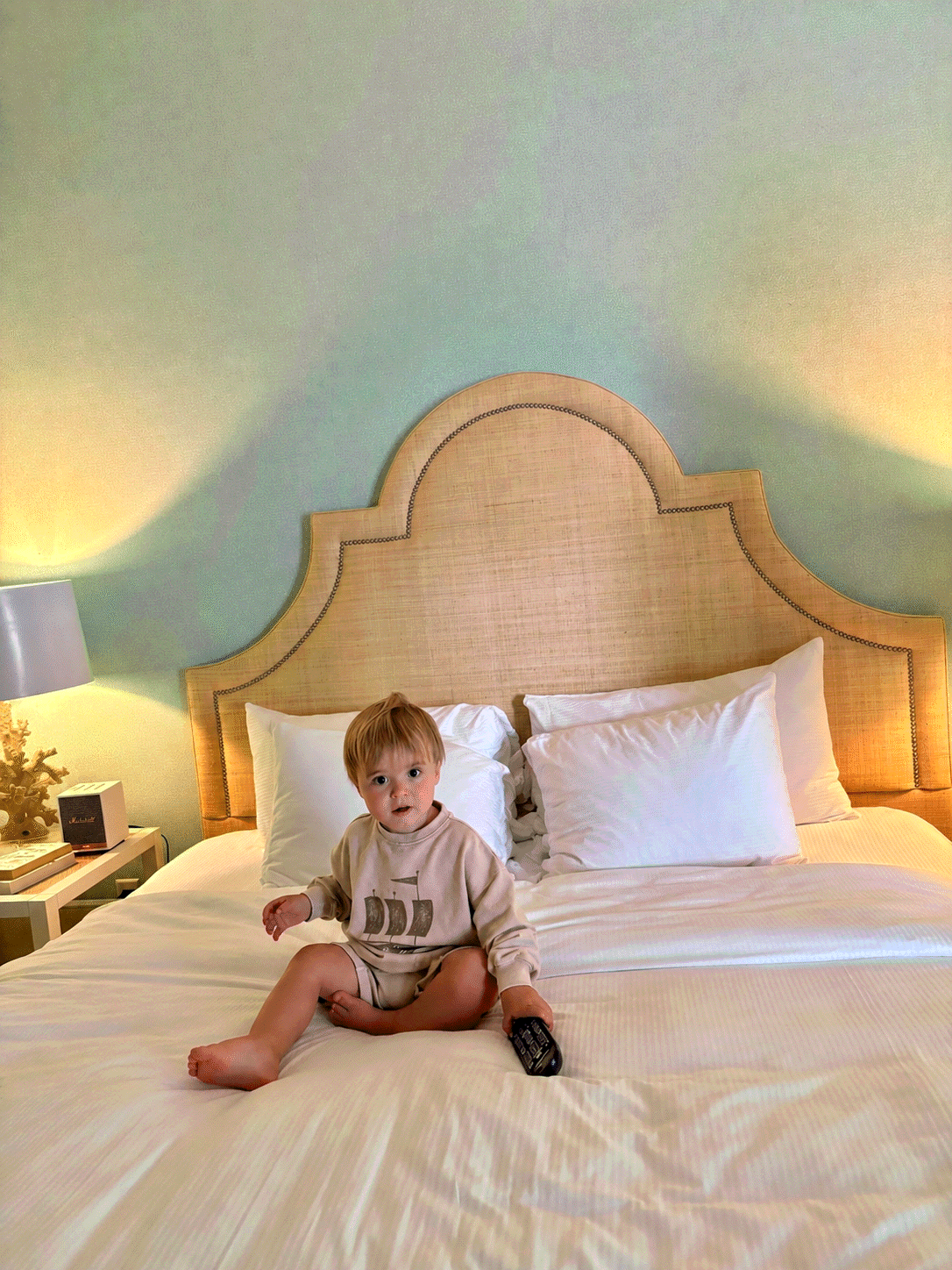 Toddler exploring a Tides King room with seating area at Tides Beach Club